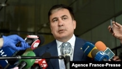 FILE - In this April 24, 2020, photo, Mikheil Saakashvili talks to the media after his meeting with Ukrainian President Volodymyr Zelensky's 'Servant of the People' ruling party members in Kyiv.