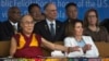 FILE - Tibetan spiritual leader Dalai Lama holds the arm of U.S. House Minority Leader Nancy Pelosi at the Tsuglagkhang temple in Dharmsala, India, May 10, 2017.