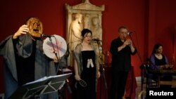 Musicians perform during a concert with reconstructed ancient instruments at the National Archaeological Museum in Athens, Greece, June 21, 2018. 