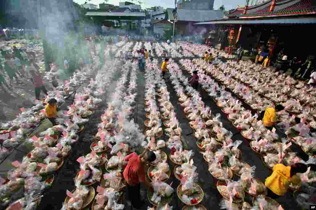Ethnic-Chinese Indonesians arrange offerings for their ancestors&#39; souls during the &quot;hungry ghost&quot; festival in Medan, North Sumatra, Indonesia.