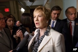 Rep. Kay Granger, R-Texas, speaks to reporters on Capitol Hill in Washington, July 25, 2014, as she emerges from a closed-door session with fellow Republicans.