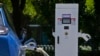 A Chinese electric vehicle charges at an electric vehicle charging station in Beijing, June 24, 2024. 