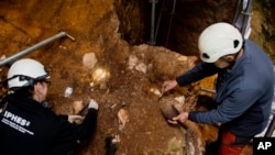 This photo provided by the Catalan Institute of Human Paleoecology and Social Evolution in March 2025 shows archaeological excavation work at in Sierra de Atapuerca, Burgos, Spain, where a fossil from a hominin was found.