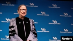 FILE - Supreme Court Justice Ruth Bader Ginsburg smiles during a reception where she was presented with an honorary doctoral degree at the University of Buffalo School of Law, in Buffalo, New York, Aug. 26, 2019.