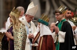 FILE - Pope Francis celebrates a new year's Mass in St. Peter's Basilica at the Vatican, Jan. 1, 2017.