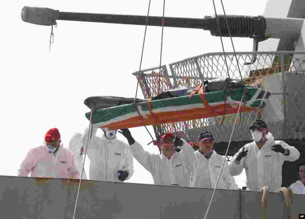 One of the 45 bodies of migrants whom were recovered by the Italian military ship Vega during its search and rescue mission in the Mediterranean sea, is being disembarked at the harbor of Reggio Calabria, Southern Italy.