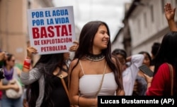 In this March 8, 2020 photo provided by Lucas Bustamante, Helena Gualinga marches in the International Women's March in Quito, Ecuador.