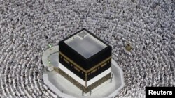 Muslim pilgrims pray ahead of the annual haj pilgrimage