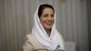 FILE - Iranian lawyer Nasrin Sotoudeh smiles at her home in Tehran, Sept. 18, 2013, after being freed following three years in prison. Iranian security agents re-arrested Sotoudeh at her home on June 13, 2018. 