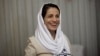 FILE - Iranian lawyer Nasrin Sotoudeh smiles at her home in Tehran, Sept. 18, 2013.