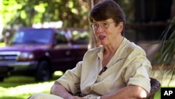 FILE - In this 2001 photo, former U.S. Attorney General Janet Reno speaks to the media at her Miami home after announcing that she would be running for Governor of Florida. 