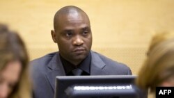 FILE - Germain Katanga, a Congolese National, sits during his trial at the International Criminal Court (ICC) in the Hague, May 23, 2014.