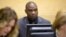 FILE - Germain Katanga, a Congolese National, sits during his trial at the International Criminal Court (ICC) in the Hague, May 23, 2014.