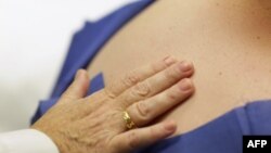 Dr. Antonella Tost, Dermatologist University of Miami School of Medicine, examines Michael Casa Nova,12, for symptoms of skin cancer due to sun exposure, June 15, 2011.