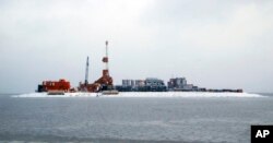 In this Oct. 17, 2017 photo provided by the Bureau of Safety and Environmental Enforcement, oil production equipment appears on Spy Island, an artificial island in state waters of Alaska's Beaufort Sea.