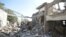People gather at a prison struck by Arab coalition warplanes in al-Zaydiyah district of the Red Sea port city of Hodeidah, Yemen, Oct. 30, 2016.