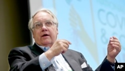 FILE - Philanthropist Howard G. Buffett, son of investor Warren Buffett, participates in a panel discussion, Feb. 2014, at the conference on cover crops and soil health, in Omaha, Neb.