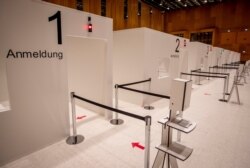 FILE - Stalls of a new vaccination center are showcased during a media tour in Wiesbaden, Germany, Dec. 7, 2020.