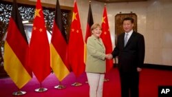 Thủ tướng Đức Angela Merkel và Chủ tịch Trung Quốc Tập Cận Bình tại Bắc Kinh, ngày 7/7/2014.