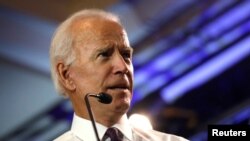 FILE - Former U.S. Vice President Joe Biden campaigns for Democratic U.S. congressional candidate Mikie Sherrill at Montclaire State University in Montclair, New Jersey, Sept. 5, 2018. 