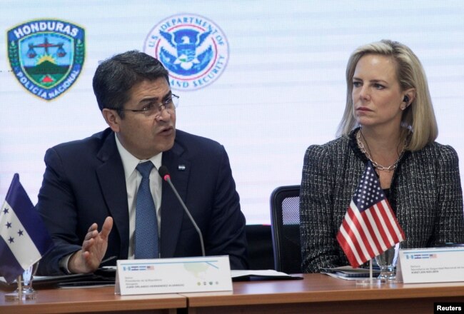Honduran President Juan Orlando Hernandez speaks beside U.S. Secretary of Homeland Security Kirstjen Nielsen during a multilateral meeting at the Honduran Ministry of Security in Tegucigalpa, Honduras, March 27, 2019.