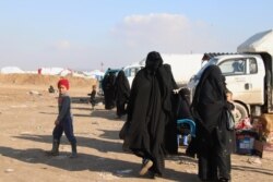 Wives and children of IS fighters are detained in al-Hol Camp in Syria, where many openly call for the "caliphate" to rise again, Feb. 18, 2020. (Heather Murdock/VOA)