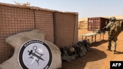 FILE - The France-led special operations logo for the new Barkhane Task Force Takuba, a multinational military mission in sub-Saharan Africa’s troubled Sahel region, is seen Nov. 3, 2020.