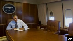 President Barack Obama signs executive order streamlining export and import process for American businesses, Feb. 19, 2014.