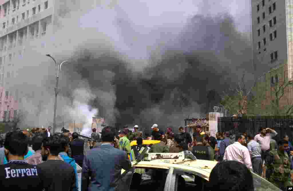 Smoke rises after a huge explosion shook the Sabaa Bahrat Square in Damascus, April 8, 2013. 