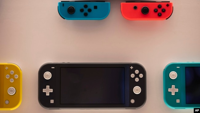 FILE - In this Thursday, Jan, 23, 2020 file photo, Nintendo Switch game consoles are on display at Nintendo's official store in the Shibuya district of Tokyo. 