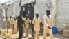 FILE - South Sudanese detainees and prisoners walk from the overcrowded Juba Central prison after they were released from the facility in Juba, South Sudan January 20, 2023. REUTERS/Jok Solomun