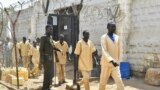 FILE - South Sudanese detainees and prisoners walk from the overcrowded Juba Central prison after they were released from the facility in Juba, South Sudan January 20, 2023. REUTERS/Jok Solomun