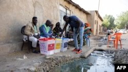 A voter casts his ballot at a polling station in N'Djamena, Chad, on Dec. 29, 2024 during the country's local, provincial and legislative elections.