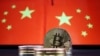 Representations of Bitcoin cryptocurrency are seen in front of an image of Chinese flags in this illustration picture taken June 2, 2021. 