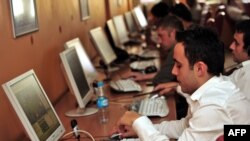 FILE - Computer users are pictured in an internet cafe in Istanbul, Sept. 3, 2009.