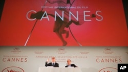 General Delegate of the Cannes Film Festival Thierry Fremaux, left and Cannes Film Festival President Pierre Lescure attend a press conference for the presentation of the 70th Cannes film festival, in Paris, April 13, 2017.