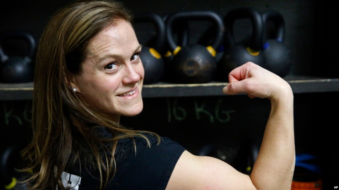 Melissa Breaux Bankston, a CrossFit athletic trainer at CrossFit Algiers in New Orleans, poses for a portrait at the gym Monday, Dec. 23, 2019. She participates in an intermittent fasting diet. (AP Photo/Gerald Herbert)