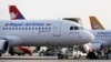 FILE PHOTO - Nepal Airlines Airbus 320 and other international airlines are seen parked inside Tribhuwan International airport in Kathmandu, Nepal, Monday, Nov. 9, 2015. 