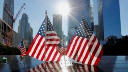 U.S. flags are seen at the 9/11 Memorial on the 20th anniversary