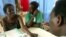 Ugandan HIV/AIDS patients listen as a doctor explains how to start anti-retroviral treatment, near Kampala, Sept. 1, 2005.