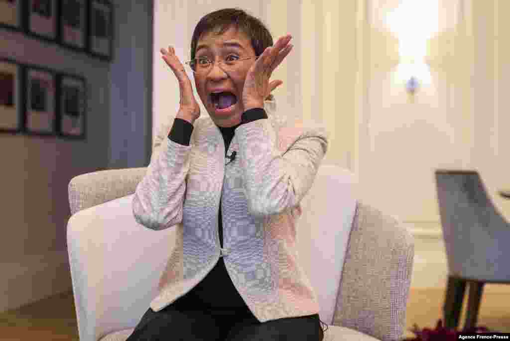 Nobel Peace Prize laureate Maria Ressa of the Philippines immitates the painting &quot;Scream&quot; by Norwegian painter Edvard Munch when asked about how she reacted to winning the award, in Oslo..