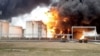 Gambar yang diambil dari rekaman video menunjukkan depot bahan bakar yang terbakar di kota Belgorod, Rusia 1 April 2022. (Foto: Kementerian Darurat Rusia via Reuters)