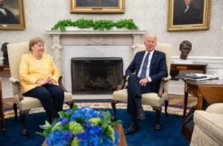U.S. President Joe Biden and German Chancellor Angela Merkel hold a meeting in the Oval Office of the White House in Washington on July 15, 2021.