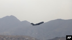 A US military aircraft takes off from the Hamid Karzai International Airport in Kabul, Afghanistan, Aug. 30, 2021.