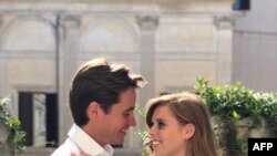 Britain's Princess Beatrice of York, right, poses with her finacee Edoardo Mapelli Mozzi in Italy, in this undated handout picture released by Buckingham Palace.