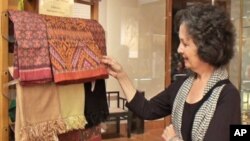 Louise Allison Cort, a ceramic curator at the Freer and Sackler galleries, is seen admiring these beautiful silk. 