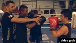 Fadi Merza, a champion Thai-style boxer who has won several titles, trains young migrants in Austria. Merza grew up in Syria.