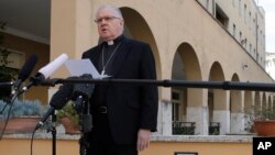 Brisbane's Archbishop Mark Coleridge reads a statement to the media on the conviction of Australian Cardinal George Pell for molesting two choir boys in the 1970s, in Rome, Feb. 26, 2019.