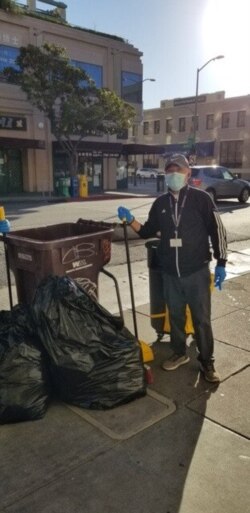 Lam Hong Le volunteers to clean the streets in Oakland Chinatown, Calif. (Tsuru for Solidarity)
