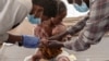 A Tigray woman who fled the conflict in Ethiopia's Tigray region, holds her malnourished and severely dehydrated baby as nurses give him IV fluids, at the Medecins Sans Frontieres (MSF) clinic, at Umm Rakouba refugee camp in Qadarif, eastern Sudan,…